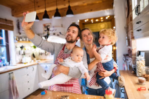 Man Taking Picture Of Him And Family